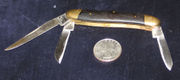 Stockman's penknife with clip, pen and sheep's foot blades; wooden grips, brass bolsters and liners