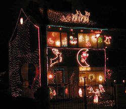 A house decorated for Christmas, illuminated with Christmas lights