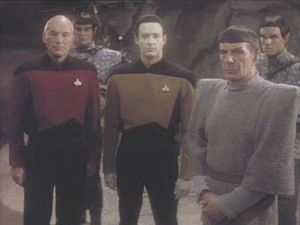 Jean-Luc Picard (Patrick Stewart) and Commander Data (Brent Spiner) standing with an older Spock in 2368.